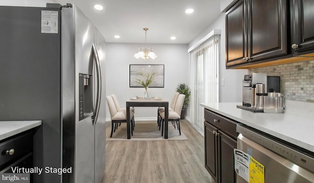 11400 Cosca Park Pl, Clinton, MD 20735 - kitchen featuring tasteful backsplash, a chandelier, recessed lighting, stainless steel appliances, and light wood-style flooring