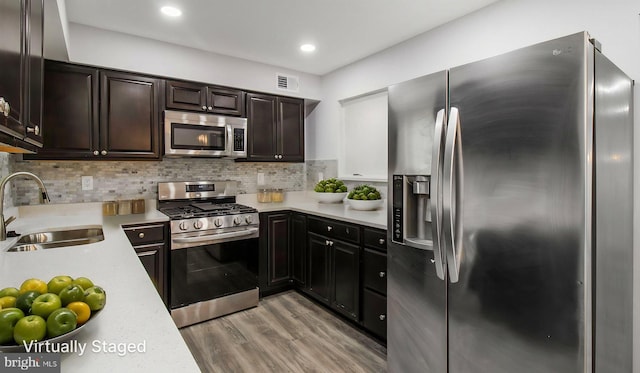 11400 Cosca Park Pl, Clinton, MD 20735 - kitchen featuring tasteful backsplash, visible vents, light countertops, a sink, and stainless steel appliances