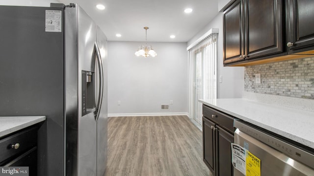 11400 Cosca Park Pl, Clinton, MD 20735 - kitchen featuring light wood-style floors, recessed lighting, a chandelier, stainless steel appliances, and backsplash