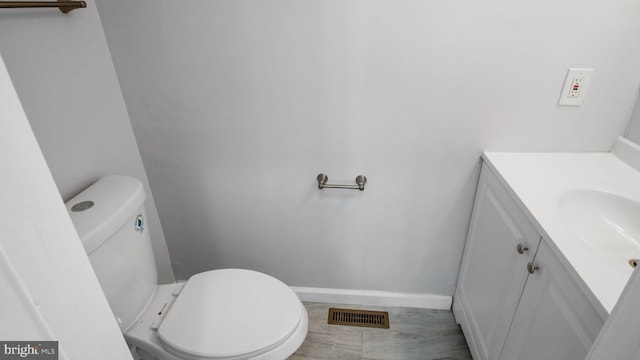 11400 Cosca Park Pl, Clinton, MD 20735 - half bath with visible vents, toilet, vanity, and baseboards