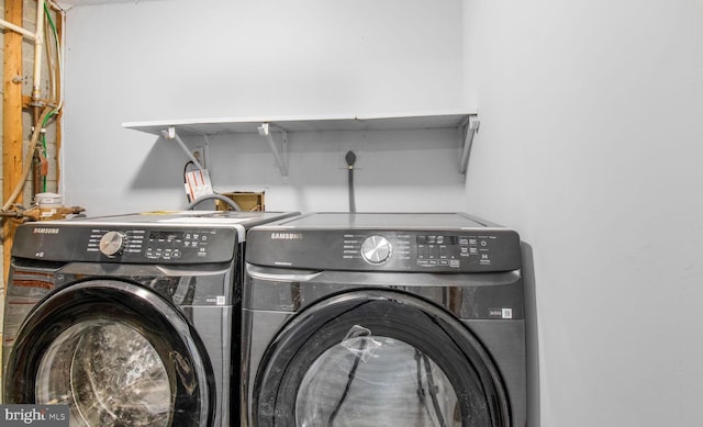 11400 Cosca Park Pl, Clinton, MD 20735 - clothes washing area with separate washer and dryer and laundry area