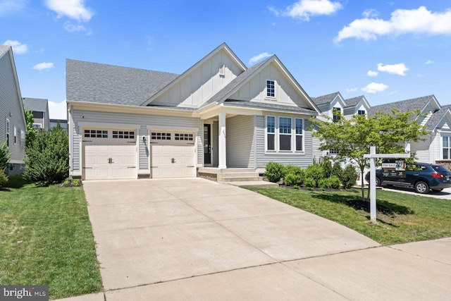 view of front facade with a garage, board and batten siding, concrete driveway, and a front lawn