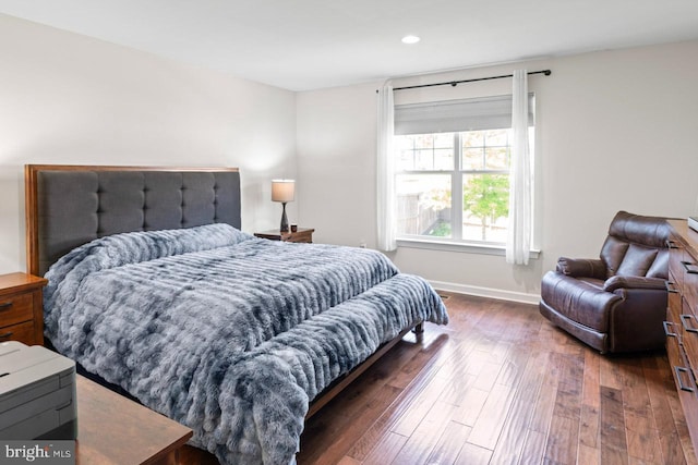 bedroom with baseboards, recessed lighting, and wood finished floors