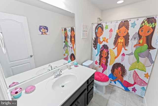 bathroom with vanity, tile patterned floors, toilet, and a shower with curtain