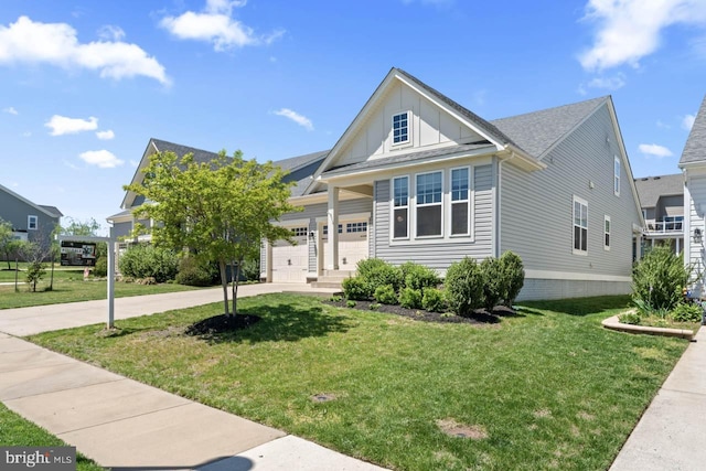view of front of house with board and batten siding, an attached garage, concrete driveway, and a front lawn
