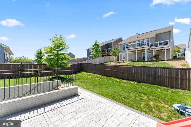 view of patio with a fenced backyard and a residential view