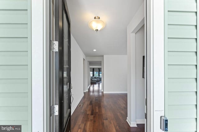 hall with recessed lighting, baseboards, and dark wood-style floors