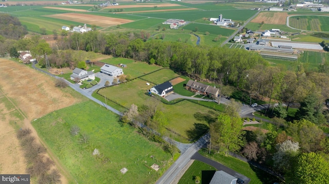 birds eye view of property with a rural view