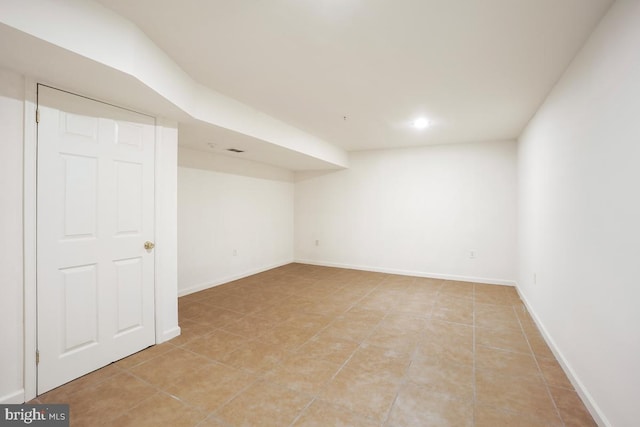 8703 Colonel Seward Dr, Fort Washington, MD 20744 - finished below grade area with light tile patterned floors and baseboards