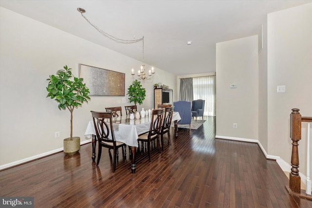 dining room with an inviting chandelier, wood finished floors, and baseboards