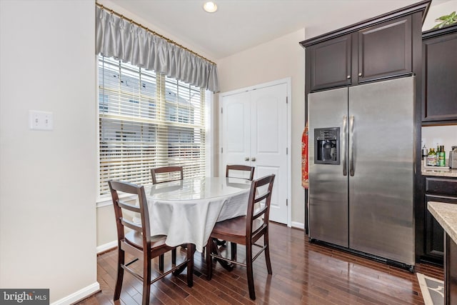 dining room with recessed lighting, baseboards, and dark wood finished floors