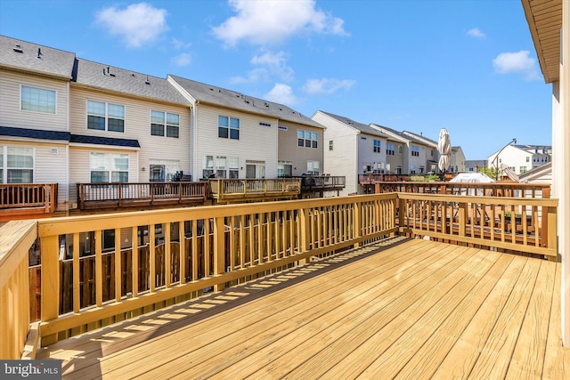 wooden terrace with a residential view