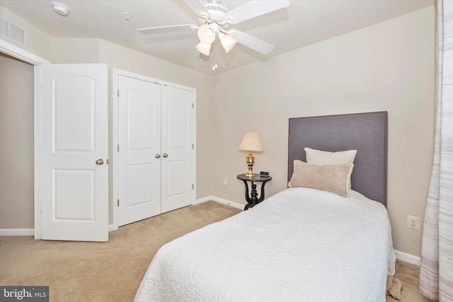 bedroom featuring a closet, visible vents, carpet floors, and baseboards