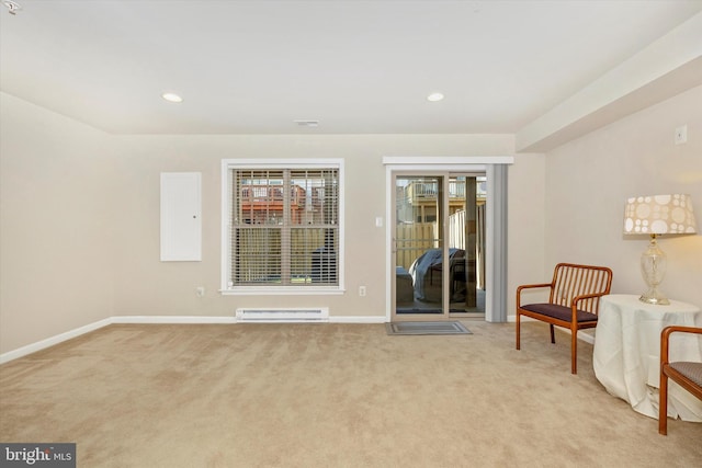 sitting room featuring recessed lighting, baseboards, a baseboard heating unit, and light carpet