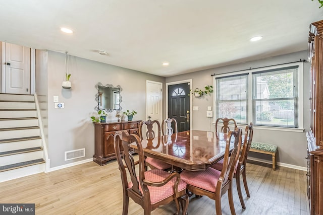 dining space featuring visible vents, stairs, baseboards, recessed lighting, and light wood-type flooring