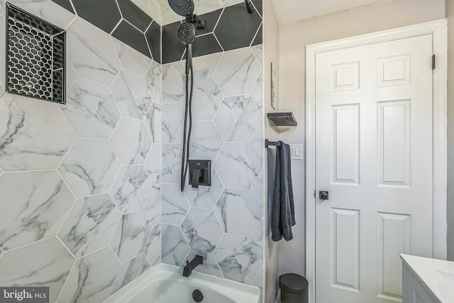 bathroom with bathing tub / shower combination and vanity
