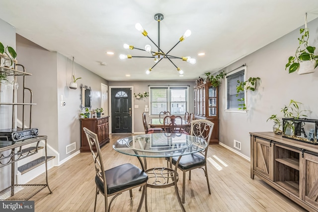 dining room with visible vents, baseboards, a chandelier, light wood-style floors, and recessed lighting