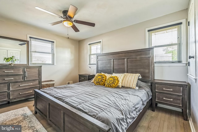 bedroom featuring a ceiling fan and wood finished floors