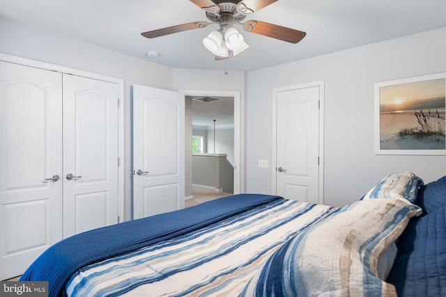 bedroom featuring a closet, a ceiling fan, and visible vents