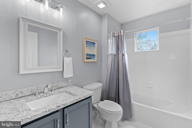 full bathroom with toilet, shower / bath combo with shower curtain, and vanity