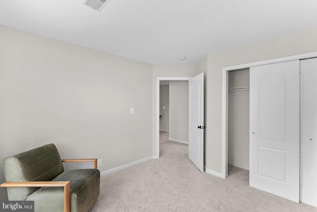 living area featuring visible vents, baseboards, and light colored carpet