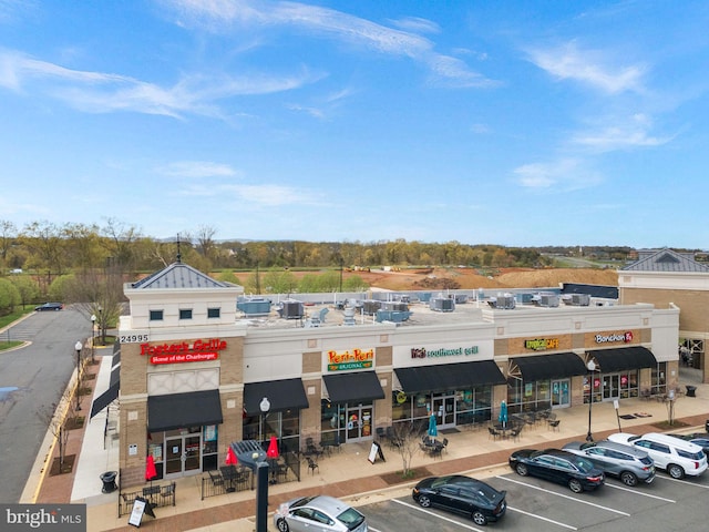 view of property featuring uncovered parking