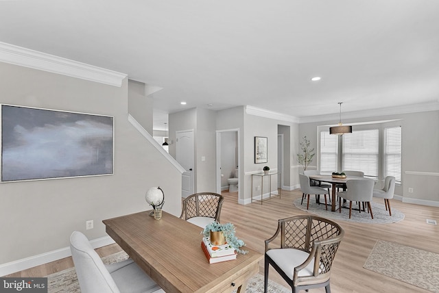 dining space featuring light wood-type flooring, ornamental molding, stairway, recessed lighting, and baseboards