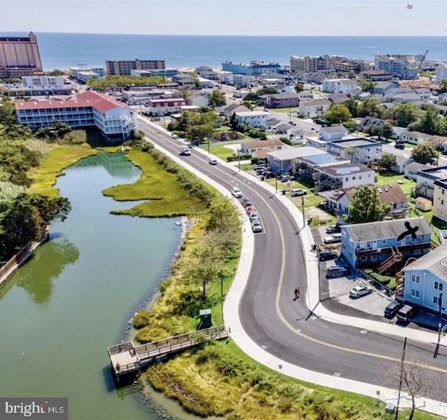 aerial view with a city view and a water view