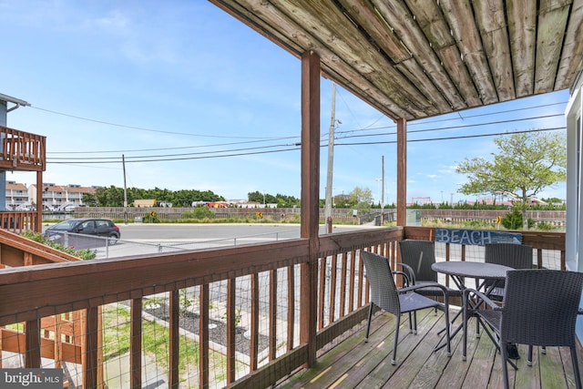 deck featuring outdoor dining area