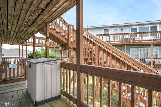 wooden terrace featuring stairway