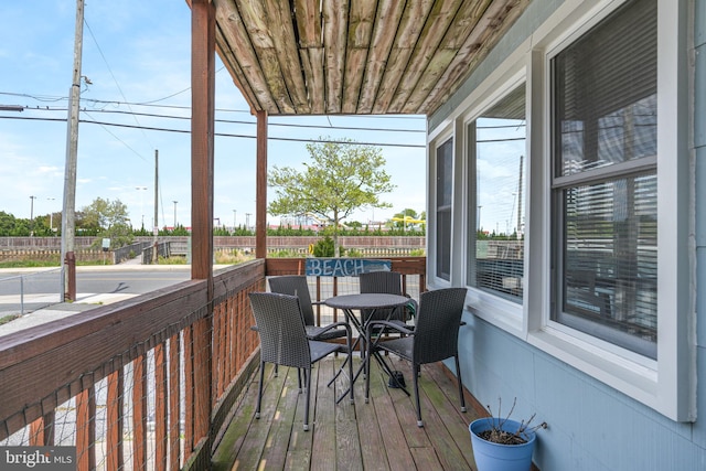 sunroom / solarium with outdoor dining area