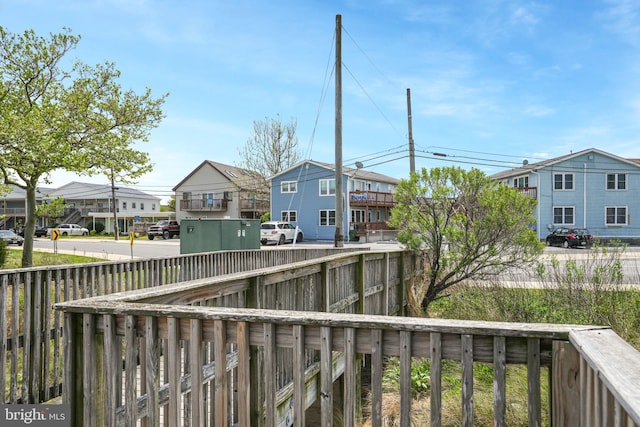 deck with a residential view and fence private yard