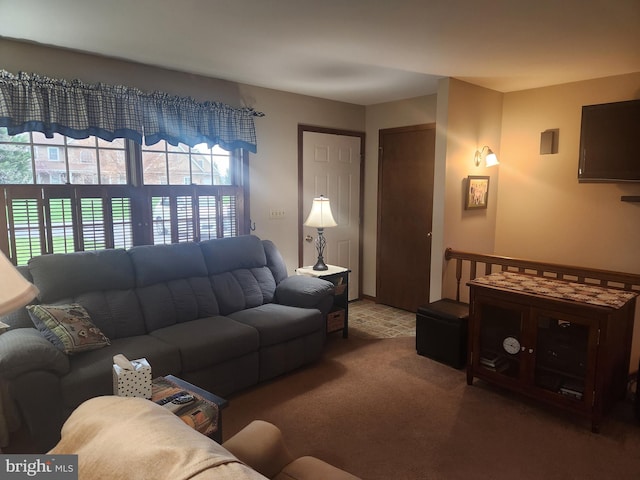 living area featuring carpet flooring and plenty of natural light