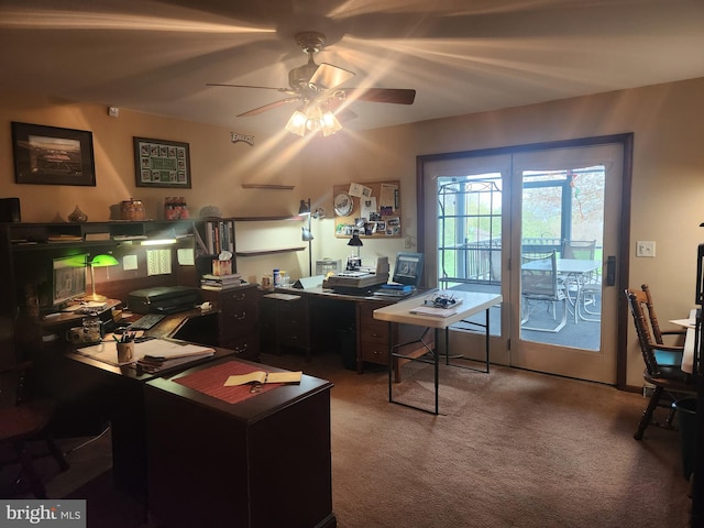 home office with a ceiling fan and carpet floors