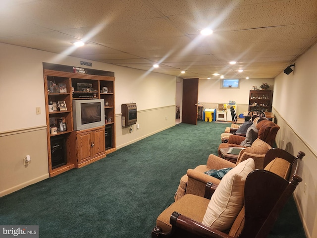 living room featuring dark carpet and heating unit