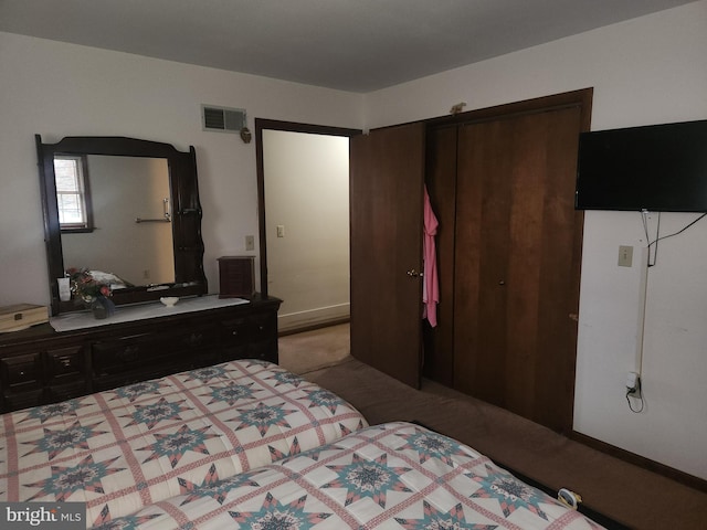 bedroom with carpet and visible vents