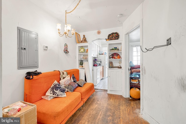 4021 7th St NE, Washington, DC 20017 - living area featuring electric panel, wood finished floors, a chandelier, and washer / clothes dryer