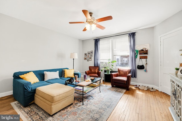 4021 7th St NE, Washington, DC 20017 - living area with light wood-style floors, baseboards, and a ceiling fan