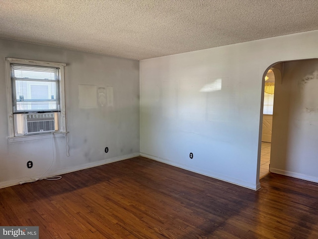 75 Unwin Dr, Hamilton, NJ 08610 - spare room featuring arched walkways, cooling unit, wood finished floors, a textured ceiling, and baseboards