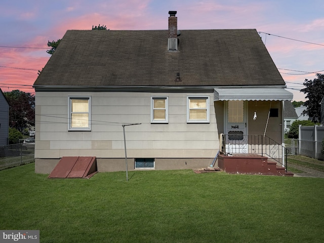 75 Unwin Dr, Hamilton, NJ 08610 - back of property featuring a shingled roof and a chimney