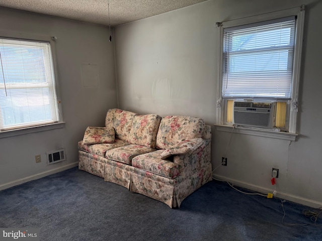 75 Unwin Dr, Hamilton, NJ 08610 - living area with a textured ceiling, plenty of natural light, carpet, cooling unit, and baseboards