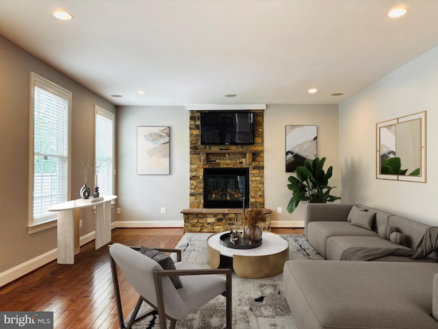 8457 Amanda Pl, Vienna, VA 22180 - living area featuring a fireplace, healthy amount of natural light, dark wood-style flooring, recessed lighting, and baseboards
