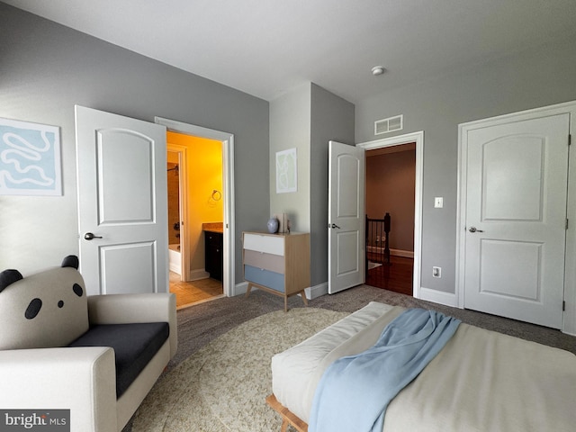 8457 Amanda Pl, Vienna, VA 22180 - bedroom featuring carpet floors, baseboards, and connected bathroom