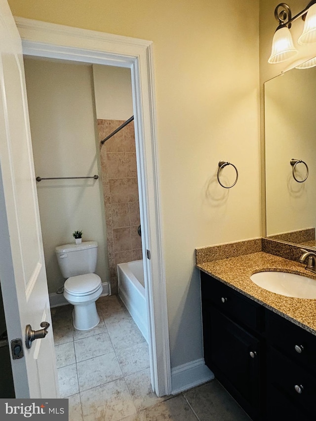 8457 Amanda Pl, Vienna, VA 22180 - full bath featuring toilet, vanity, tile patterned floors, washtub / shower combination, and baseboards