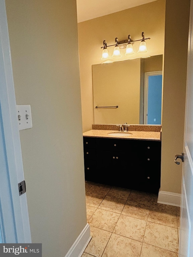 8457 Amanda Pl, Vienna, VA 22180 - bathroom featuring vanity, tile patterned flooring, and baseboards