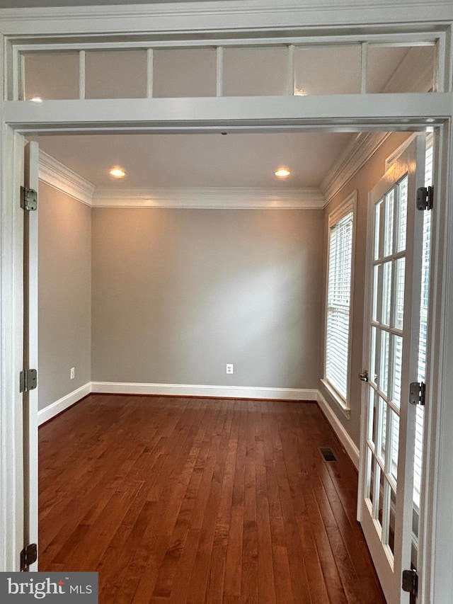 8457 Amanda Pl, Vienna, VA 22180 - spare room with ornamental molding, baseboards, dark wood-style floors, recessed lighting, and french doors