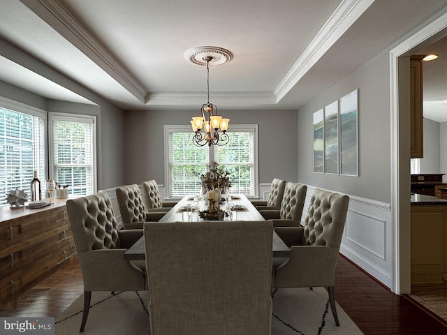 8457 Amanda Pl, Vienna, VA 22180 - dining area featuring a raised ceiling, dark wood-style floors, a chandelier, crown molding, and a wainscoted wall