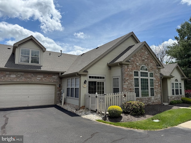 61 Legacy Oaks Dr, Richboro, PA 18954 - traditional-style home featuring stone siding, a shingled roof, asphalt driveway, and a garage