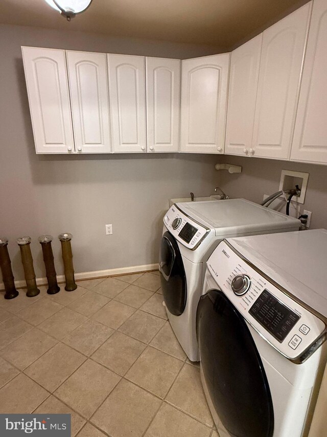 61 Legacy Oaks Dr, Richboro, PA 18954 - washroom with cabinet space, independent washer and dryer, light tile patterned flooring, and baseboards