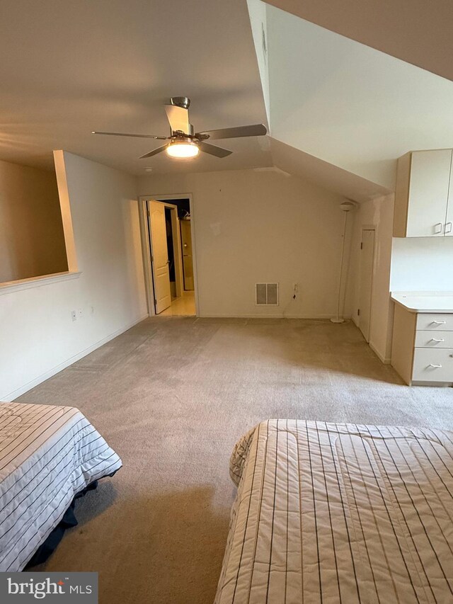61 Legacy Oaks Dr, Richboro, PA 18954 - unfurnished bedroom with light colored carpet, vaulted ceiling, and ceiling fan